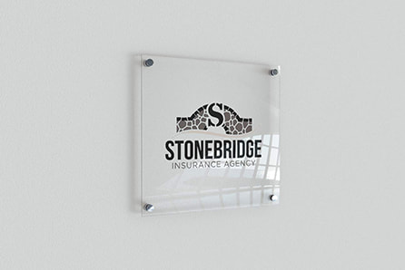 Stonebridge Insurance Agency Logo on a glass frame on the wall